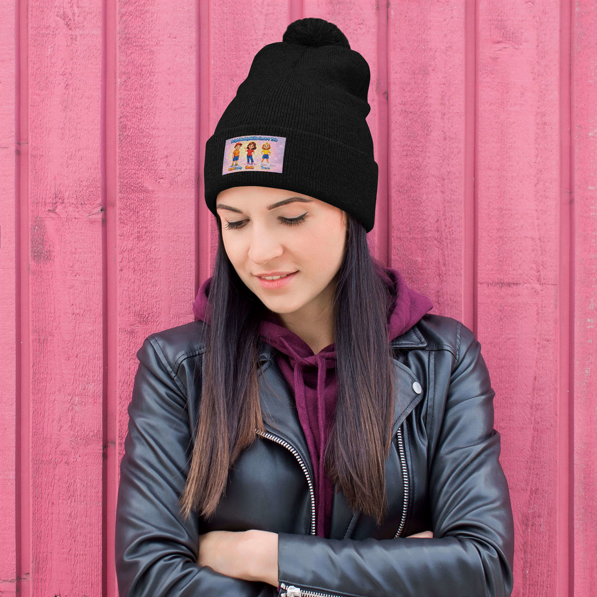 BrightBuddySkills Smart Trio pom-pom knit beanie, black, front view — product mockup